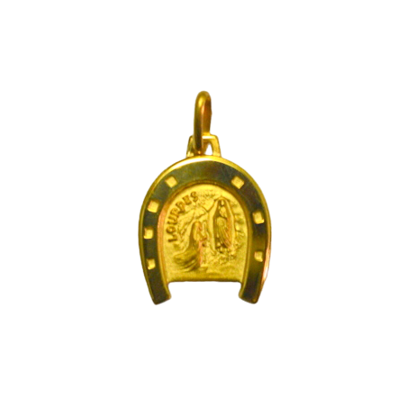 Gold plated horseshoe medal at the "Apparition"